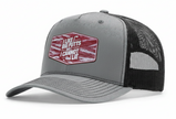 Gray and black cap with a red and white patch on a white background