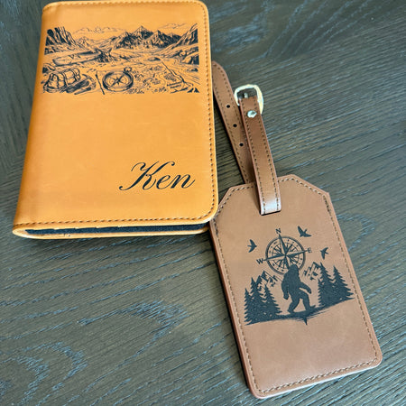 Leather travel set with engraved design on a wooden surface